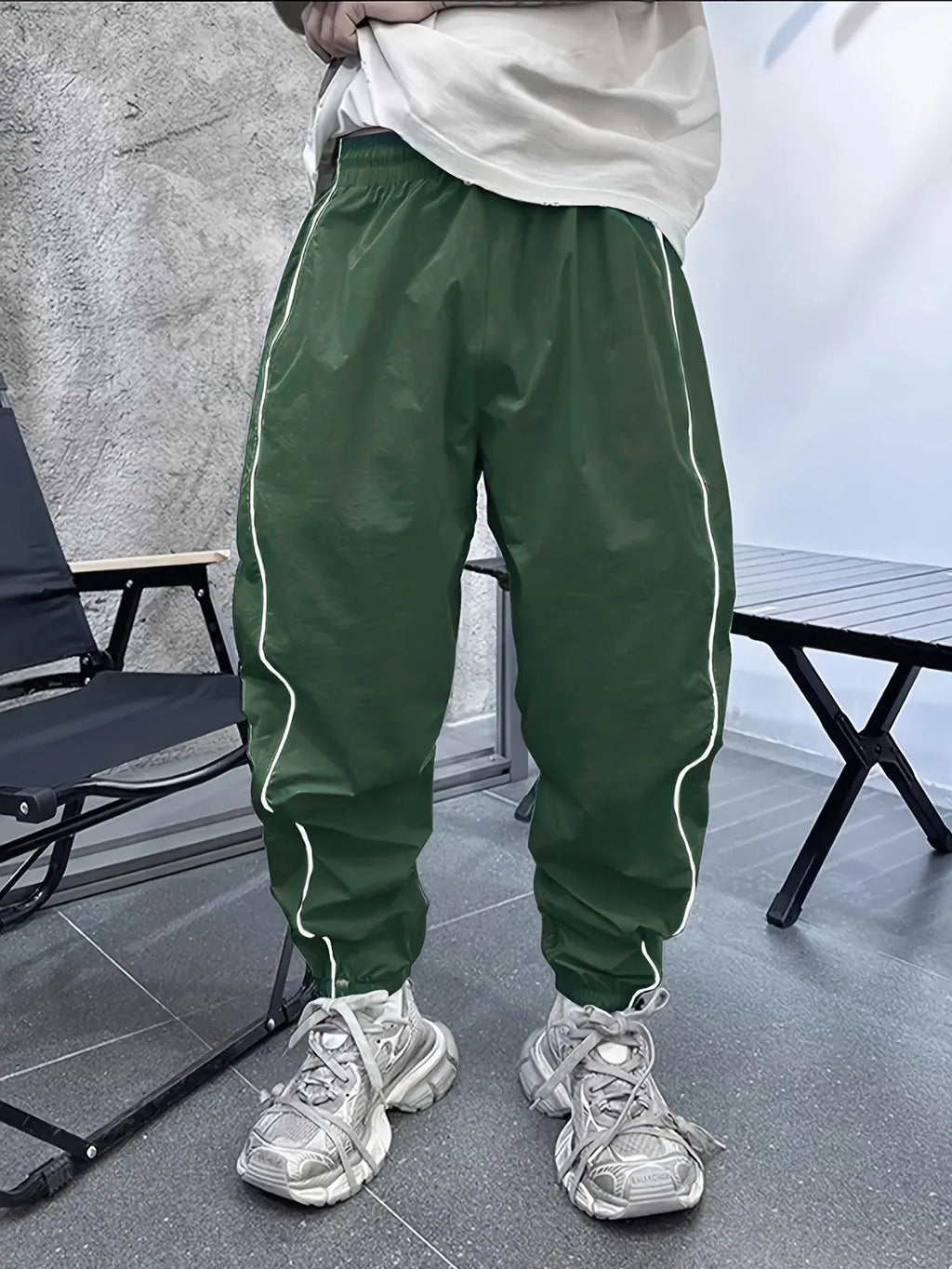 Men's loose fit bamboo fibre sports trousers in Army Green colour showing cropped length design