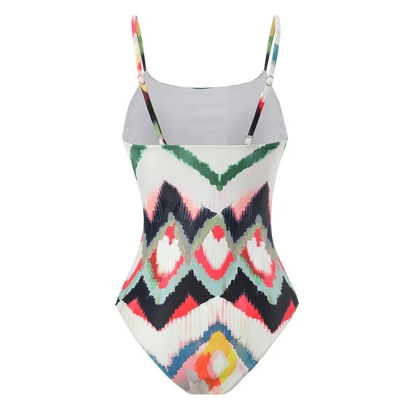 Women's striped two-piece swimsuit set with a matching hip skirt on a neutral background