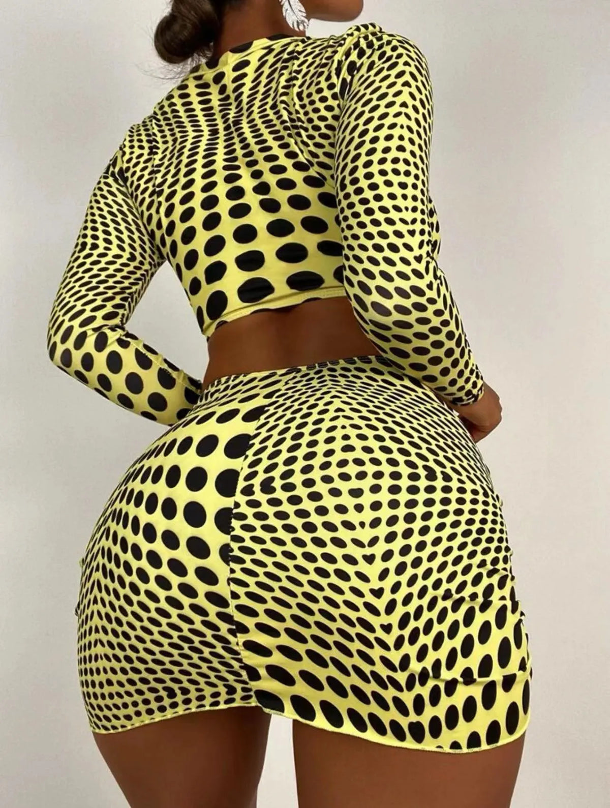 Green and yellow polka dot women's swimsuit three-piece set including top, skirt, and bra.