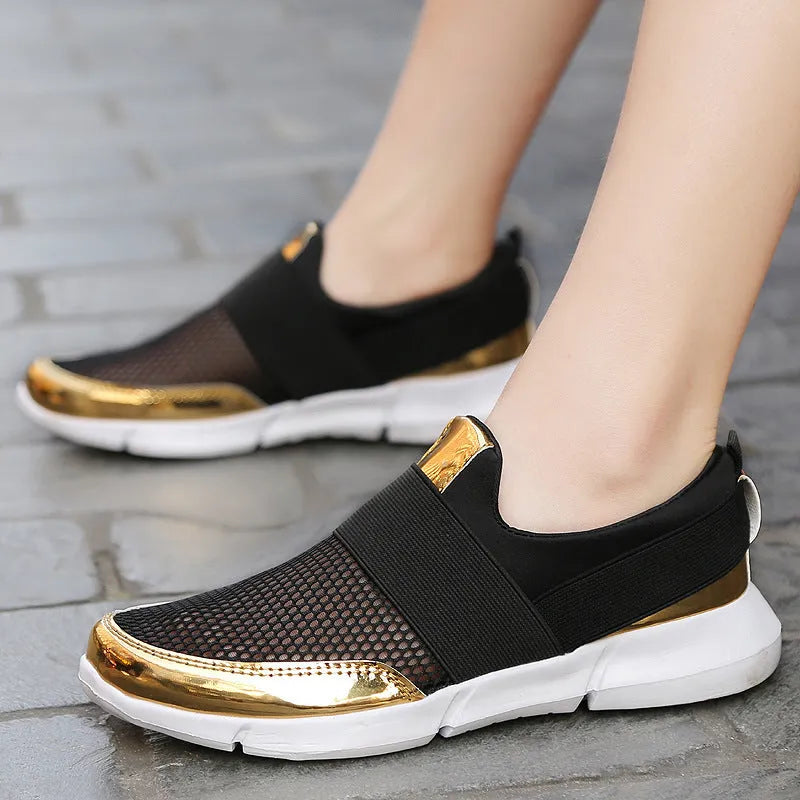 Women's lightweight sneakers with mesh interior in blue, black, and grey colours showing low-cut design