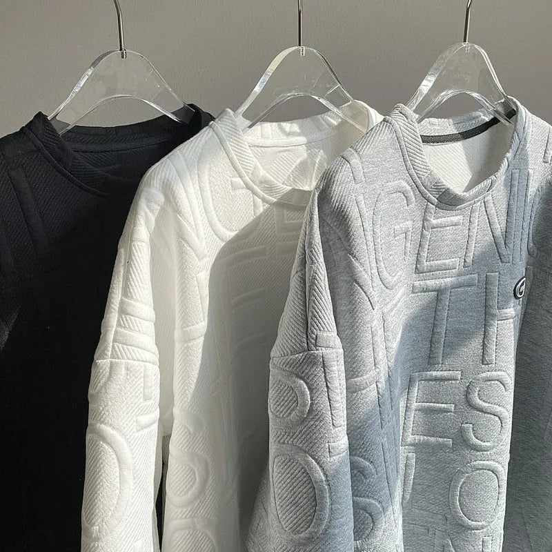 Men's loose fit grey t-shirt with a raised black three-dimensional retro letter print on the front.