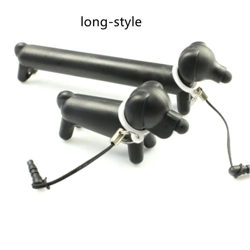 Black dog-shaped touch screen stylus pen shown next to a smartphone on a desk.