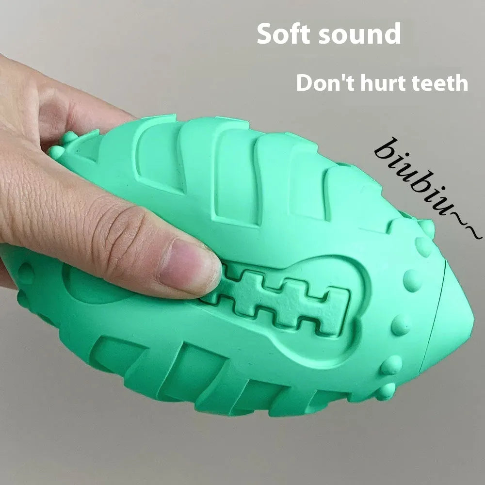 Sapphire blue rubber rugby ball dog toy with bite-resistant thickened construction.