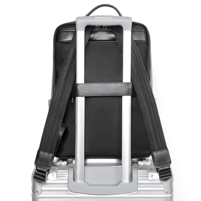 Men's black genuine leather computer backpack with weaving detail and large 36-55L capacity.