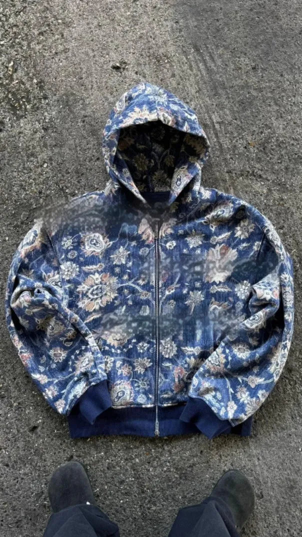 Men's blue loose hooded zip coat with long sleeves on a hanger