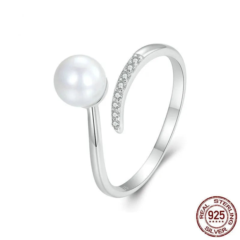 Sterling silver adjustable ring with natural shell pearls on open band design