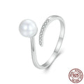 Sterling silver adjustable ring with natural shell pearls on open band design