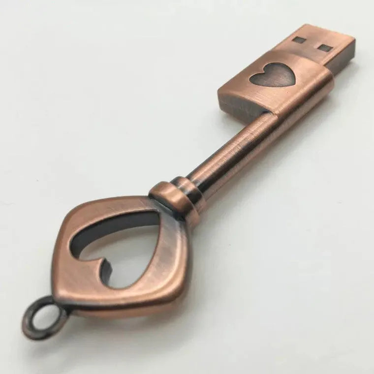 Heart shaped bronze metal USB flash drive pendant with USB 2.0 interface and write protection switch.