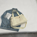 Women's large canvas shoulder tote bag with sandwich pockets and phone compartment in solid colour