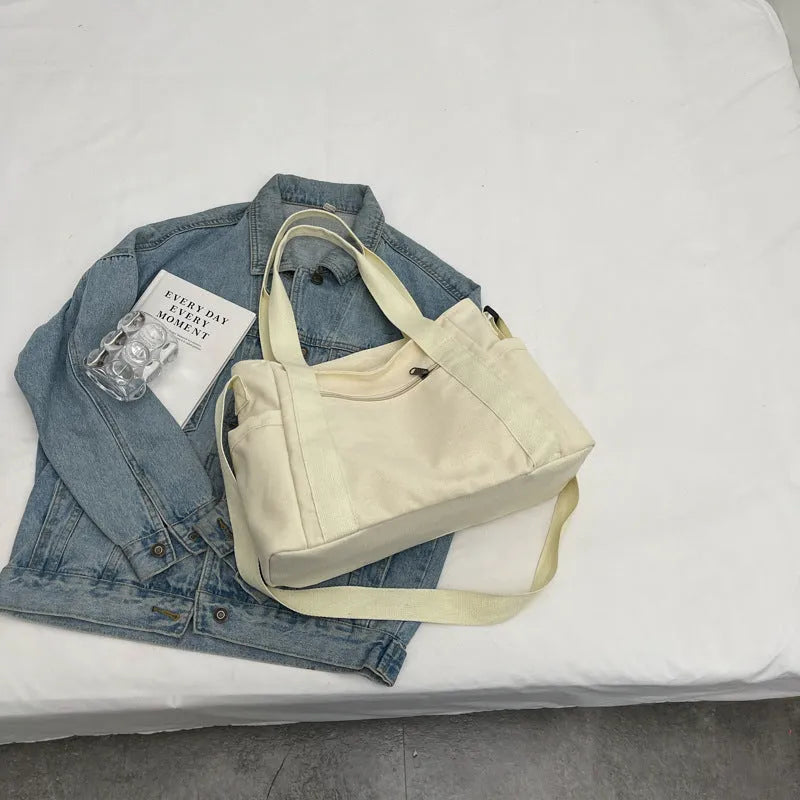 Women's large canvas shoulder tote bag with sandwich pockets and phone compartment in solid colour