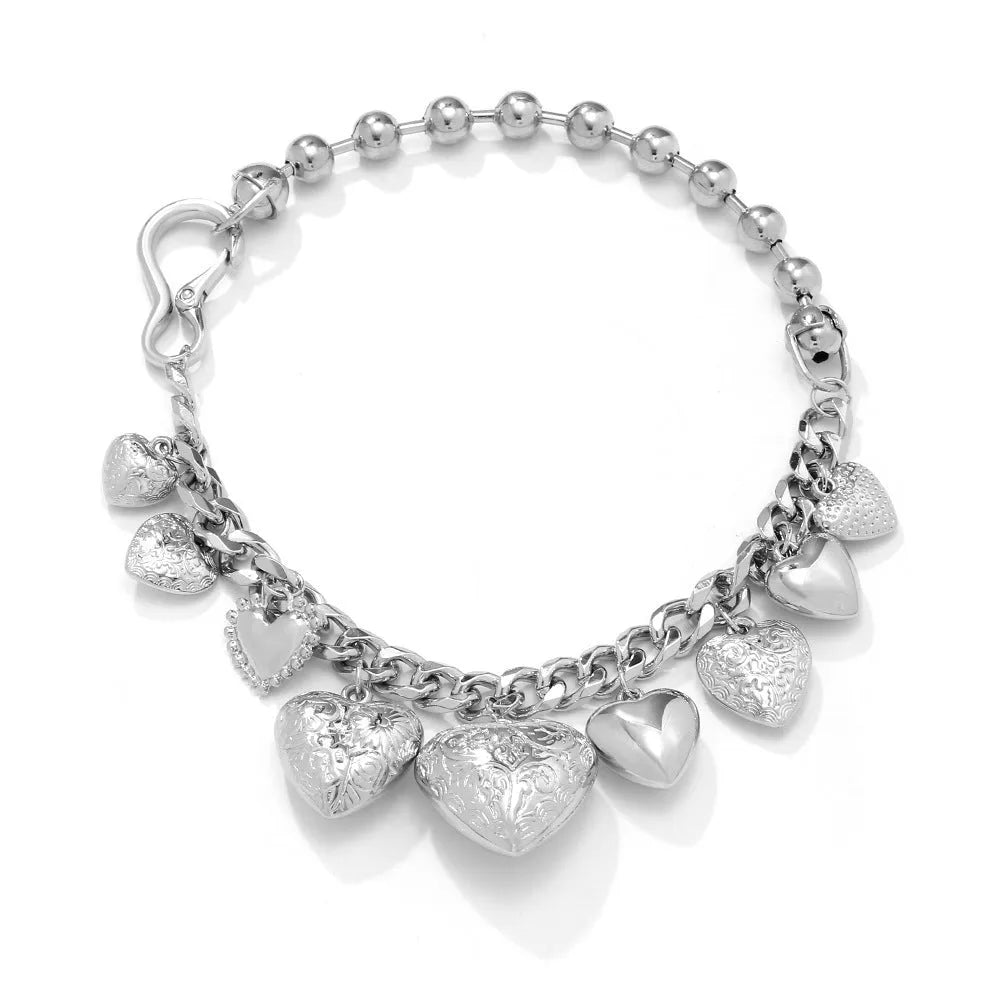 Exaggerated style carved heart pendant necklace for women in gold or white K on a regular chain.