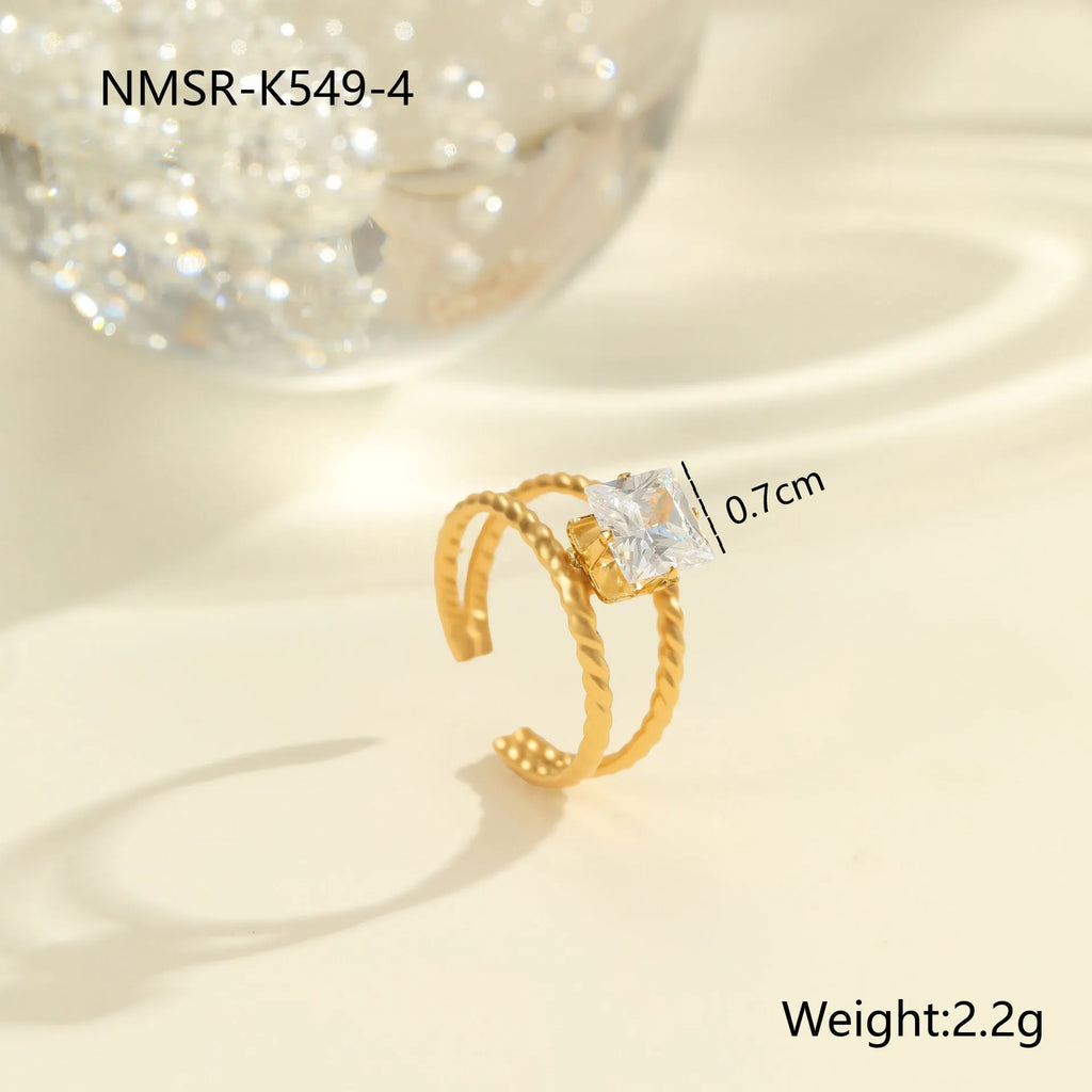 Gold electroplated stainless steel ring with zircon geometric design on adjustable open mouth band
