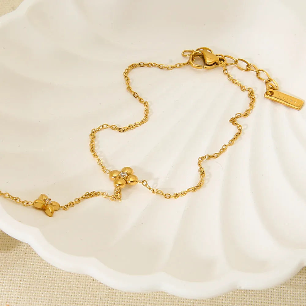 Gold colour stainless steel bracelet with flower and eight-pointed star geometric design for women