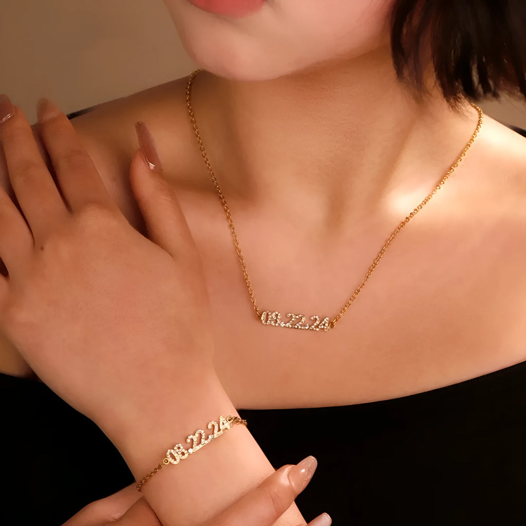 Stainless steel digital bracelet with diamond-set numbers, shown in gold, rose gold, and steel colour options.