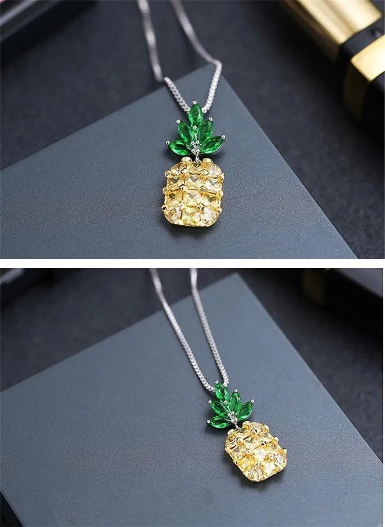 Silver geometric pineapple necklace with diamond-style stones on model