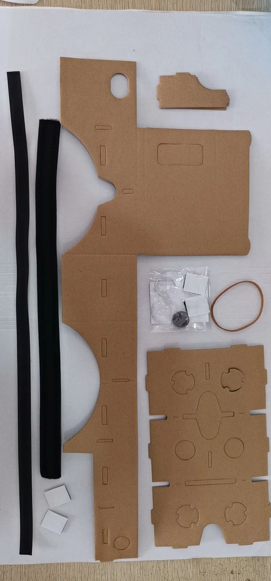 Pink and white cardboard VR glasses for smartphones with 3D lenses and adjustable headband