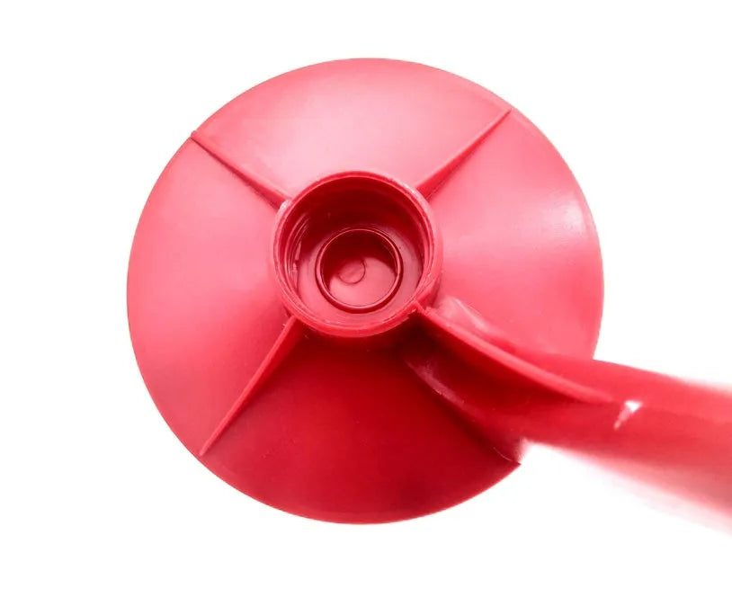 Red plastic Magic Tap soda bottle dispenser attached to a 2-litre drink bottle