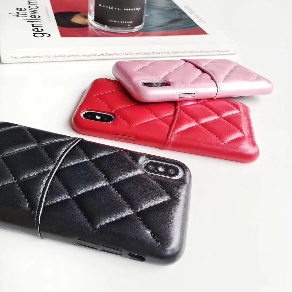 Black leather mobile phone case for iPhone XS Max on a table
