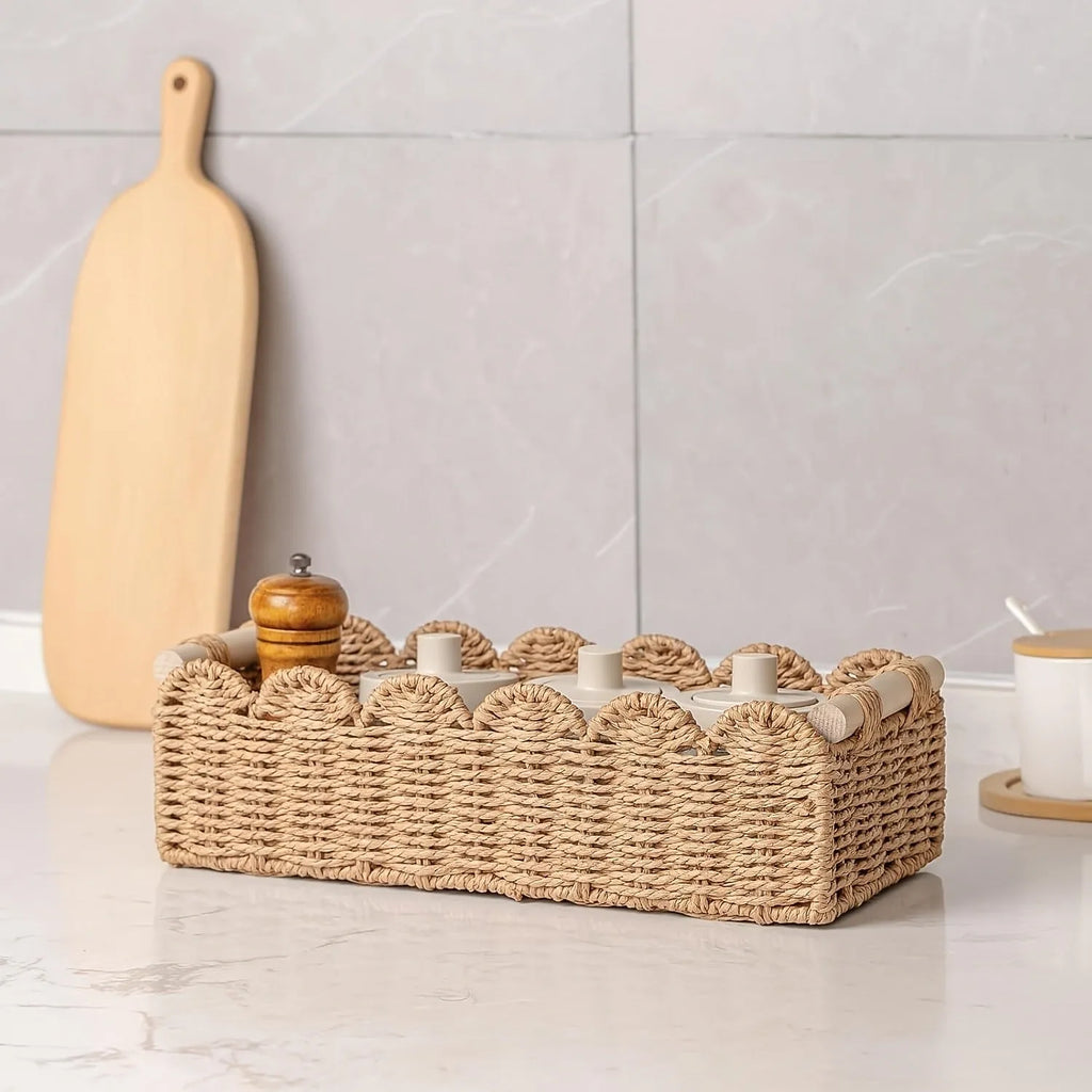 Rectangular woven paper storage basket in khaki colour on a wooden table.