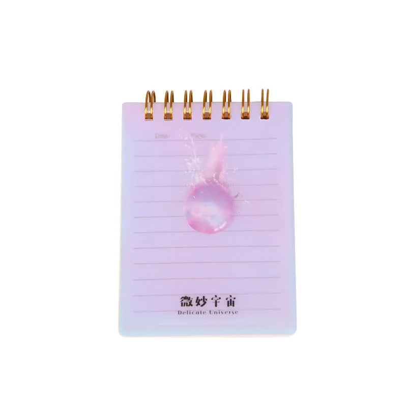 Rollover coil spiral notebook in A7 size with PP plastic cover showing Constellation design and open pages