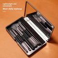 Makeup brush kit with built-in mirror showing silver or gold plastic handles and artificial fibre bristles