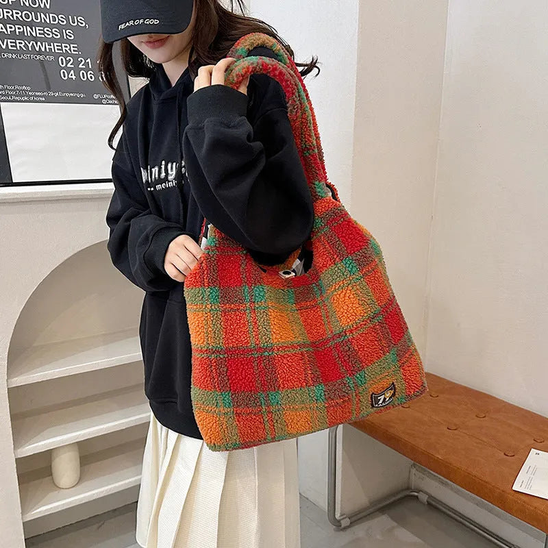 Women's plaid crossbody shoulder bag in soft plush material showing orange, purple and army green colour options