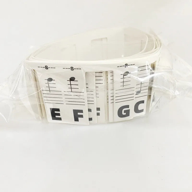 88 key piano note stickers with staff notation and coloured bars on white cardboard