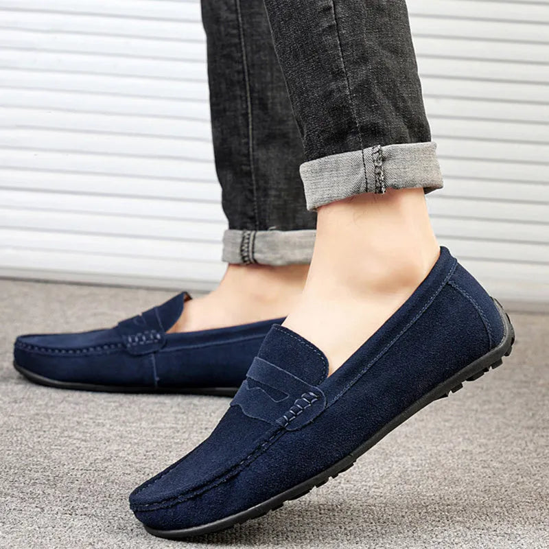 Men's brown suede slip-on loafers with round toe and flat rubber sole