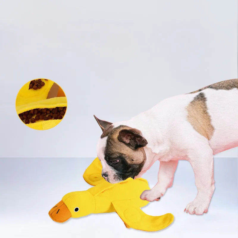 Yellow plush duck dog training toy with squeaker and treat dispensing features