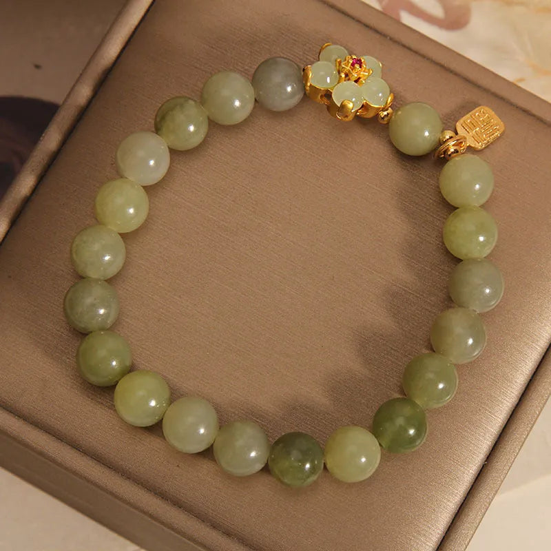 A grey jade coloured alloy bracelet for women in a casual style.