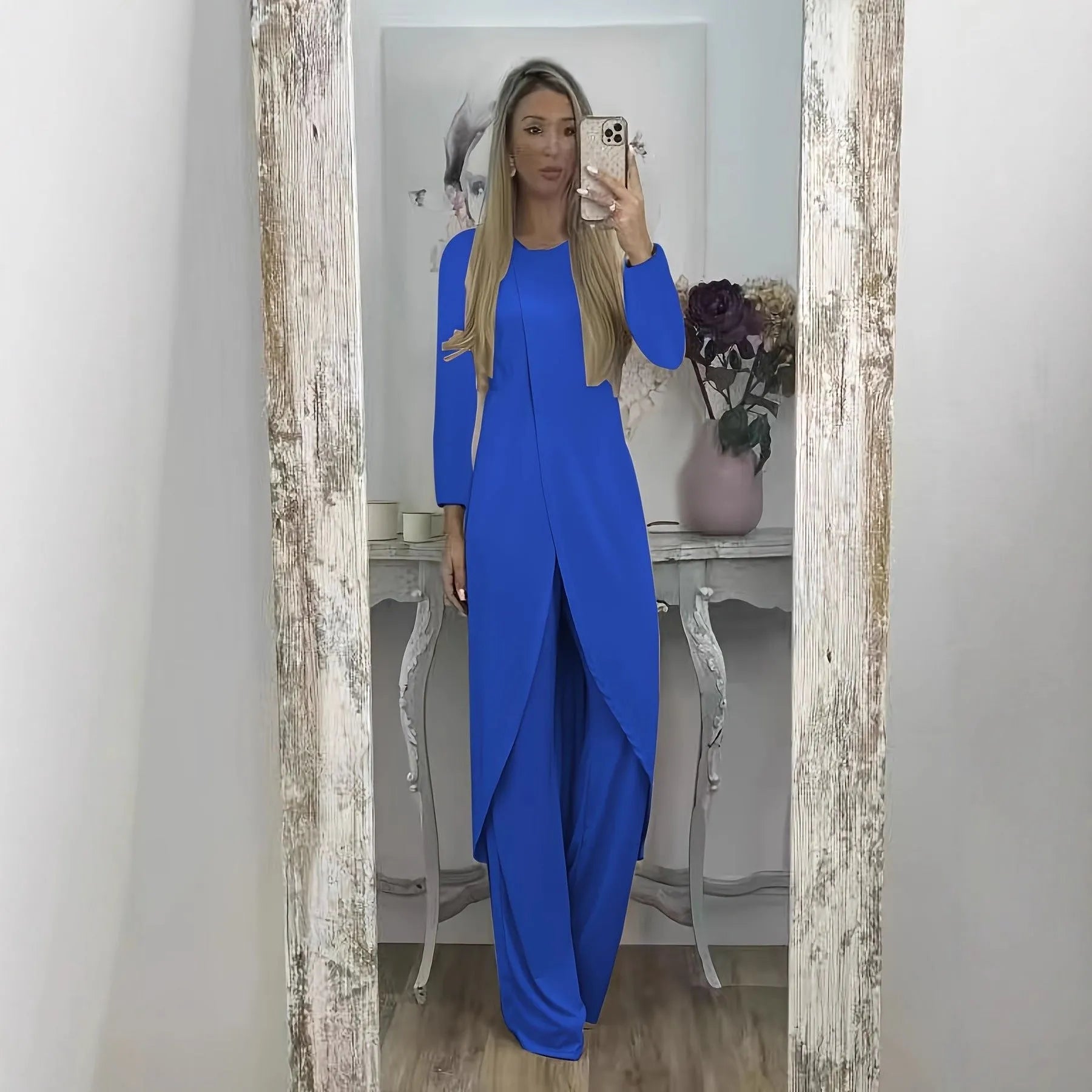 Women's black casual two-piece lounge set with long sleeves and matching trousers on a hanger