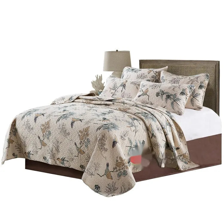 American style quilted cotton bed cover set with matching pillowcases on bed