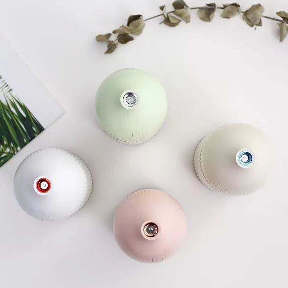 White ultrasonic aromatherapy diffuser with LED light and 300ml capacity for home use