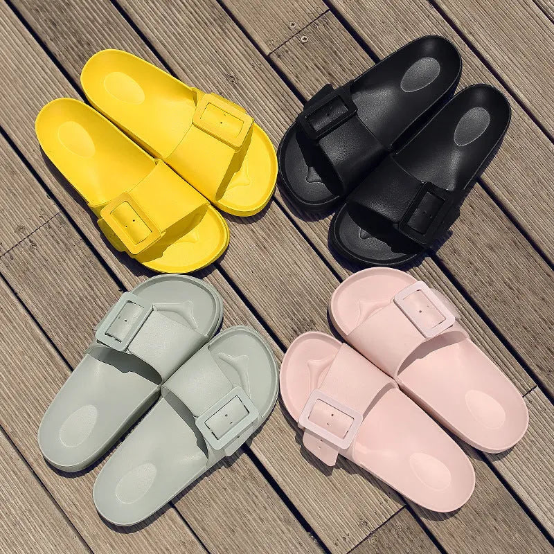 Women's grey-blue EVA flip-flop slippers with a silver buckle fastening on a white background.