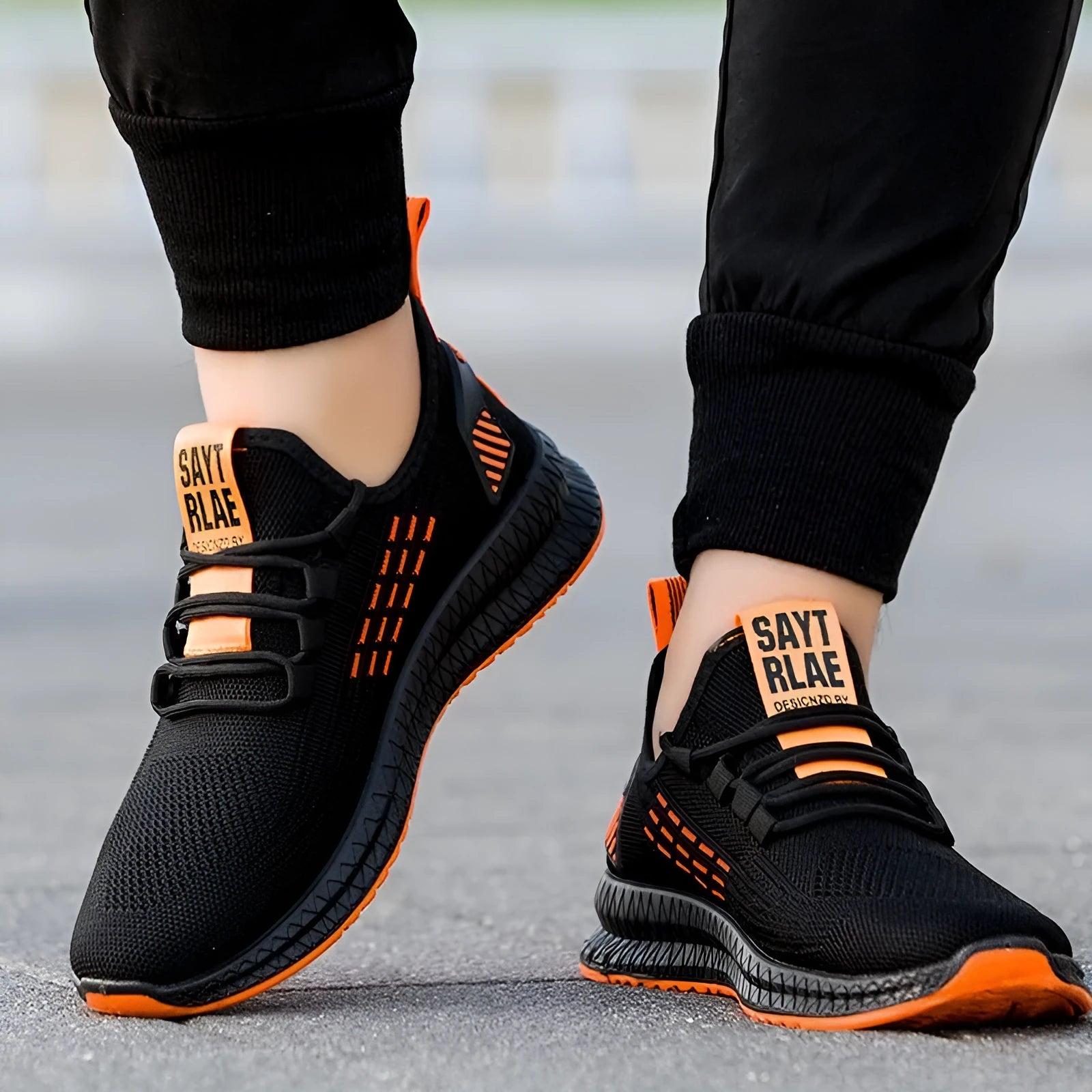 Men's low-top casual trainers with three-bar stripe pattern and cross-strap design in Flying Weave fabric