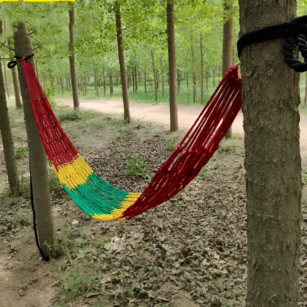 Outdoor nylon rope mesh hammock hanging between trees