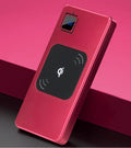 Silver portable power bank with LCD display showing battery percentage, next to a mobile phone.