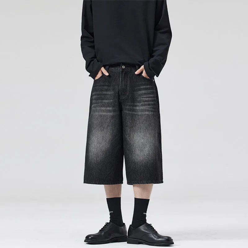 Cropped straight-leg denim shorts in light blue colour showing loose fit styling