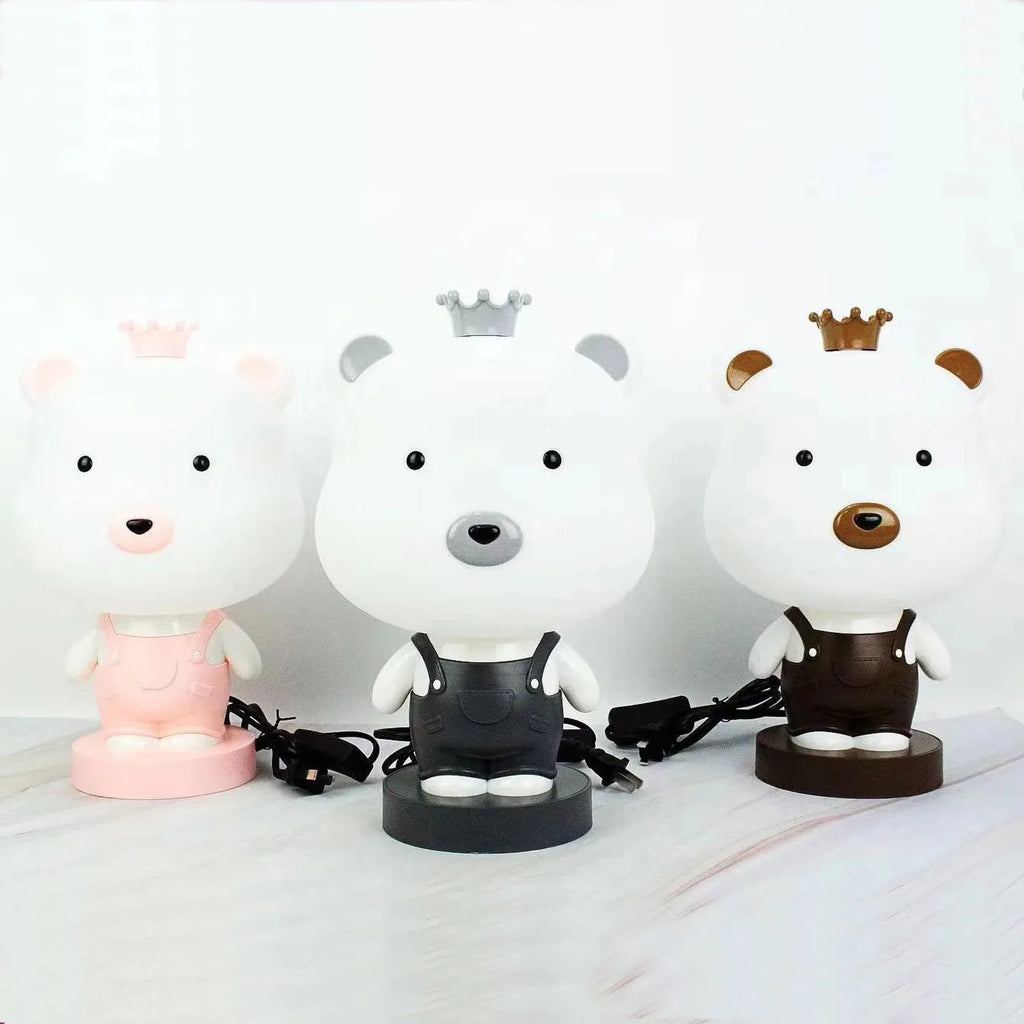 Cartoon animal table lamp in bear, cattle, rabbit, or tiger design with plastic shade and LED light.