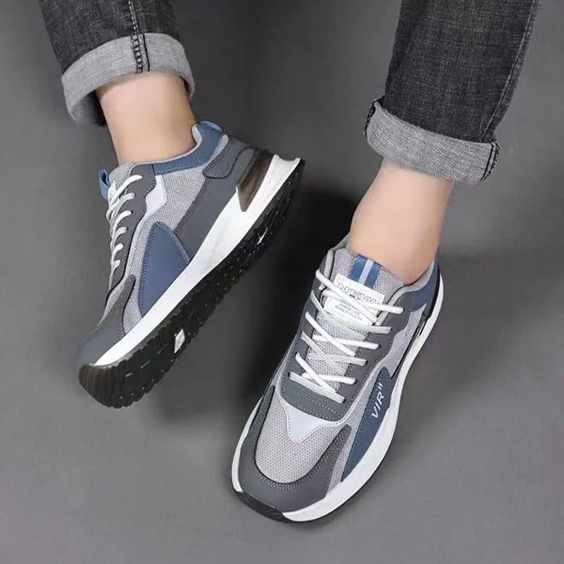 Men's colour block mesh sneakers in grey with lace-up front and low-top design.