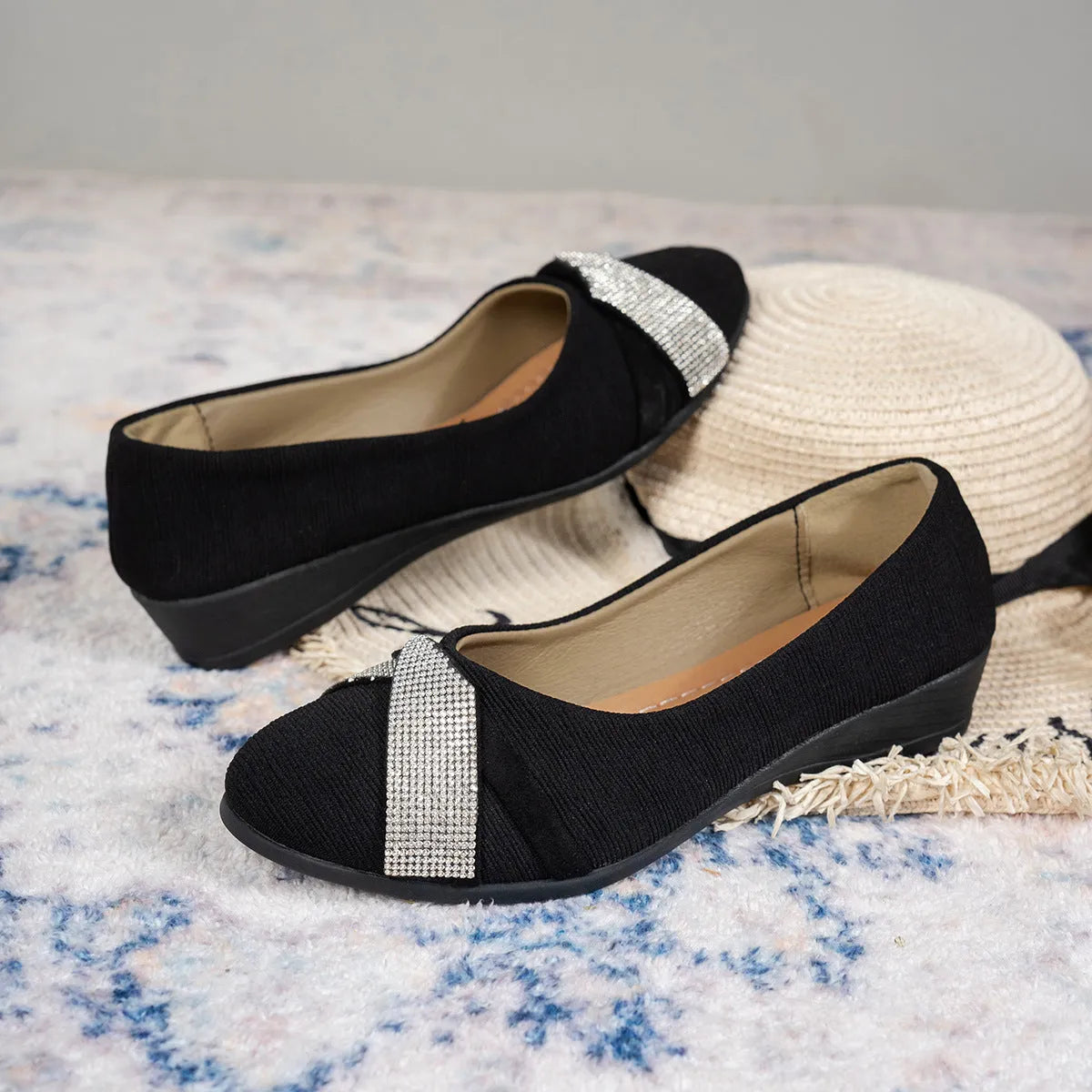 Women's black casual slip-on shoes with rhinestone details on fabric upper and chunky heel