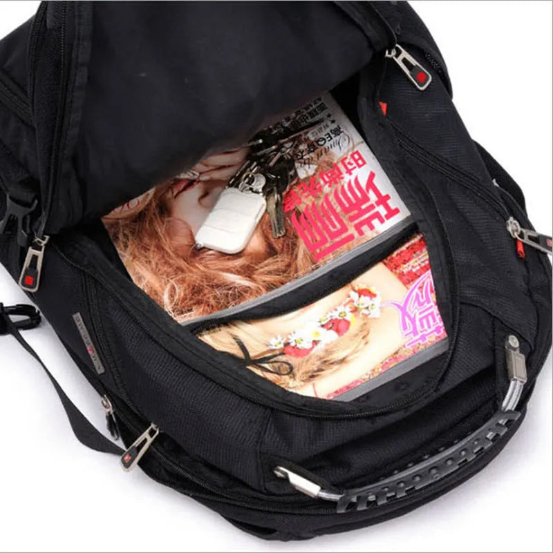 Black 38-litre business laptop backpack open to show three internal compartments and organiser pockets.