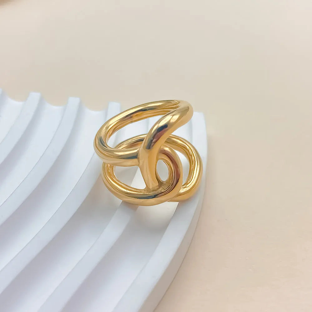 Adjustable knotted ring for women showing geometric U-shape design with line detailing