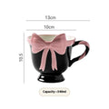 Ceramic mug with heart bow design in black pink or white powder colour, 301-400ml capacity