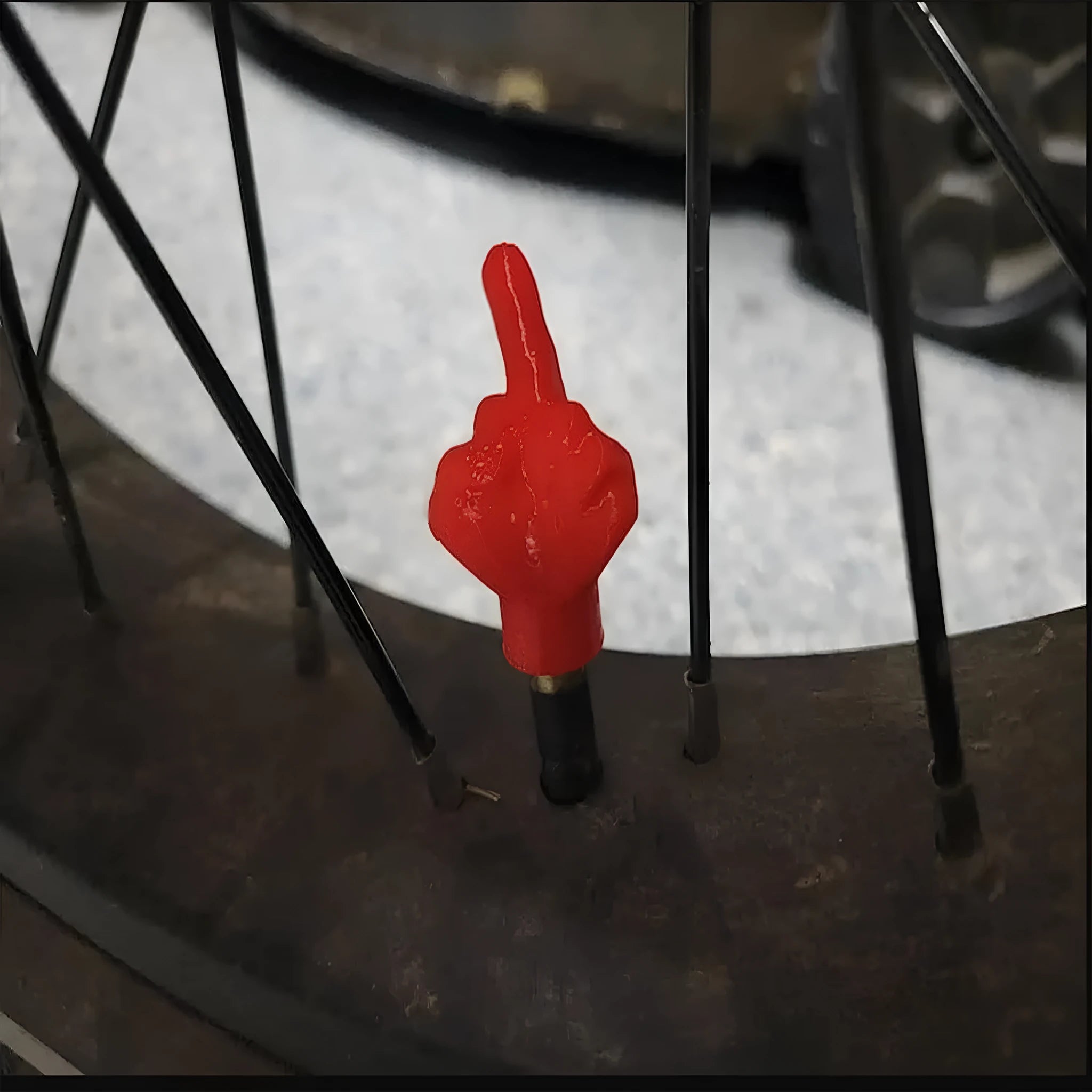 Four latex tyre valve dry caps showing black and skin tone finishes for car wheel protection