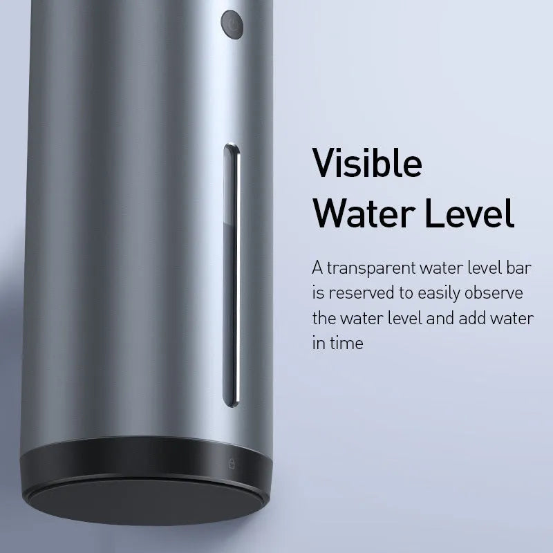 Black aluminium USB car humidifier and essential oil diffuser on a car dashboard.