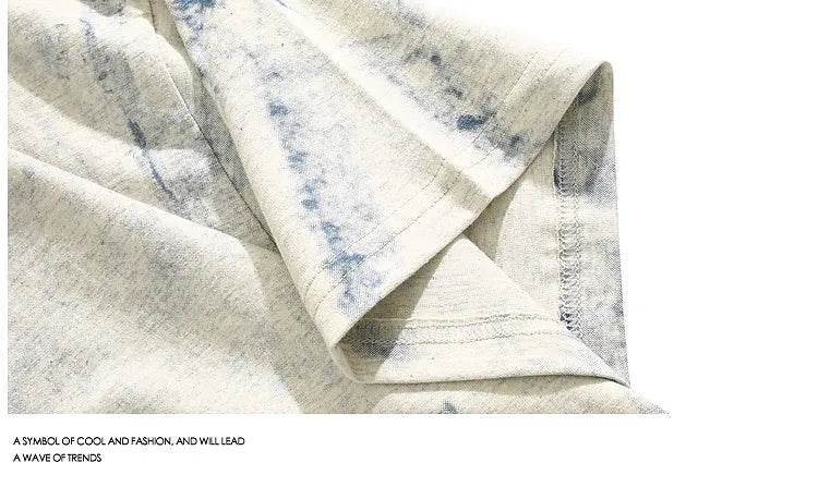 Grey tie-dye patterned loose fit short sleeve t-shirt on a hanger.