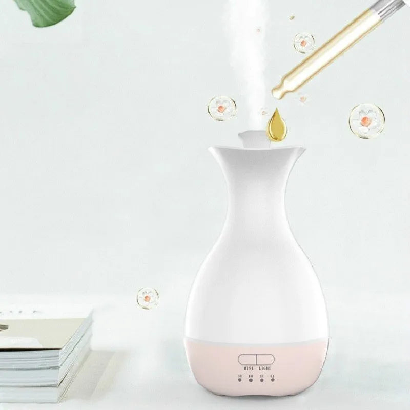 White or pink ultrasonic humidifier and essential oil diffuser vase with colourful LED night light.