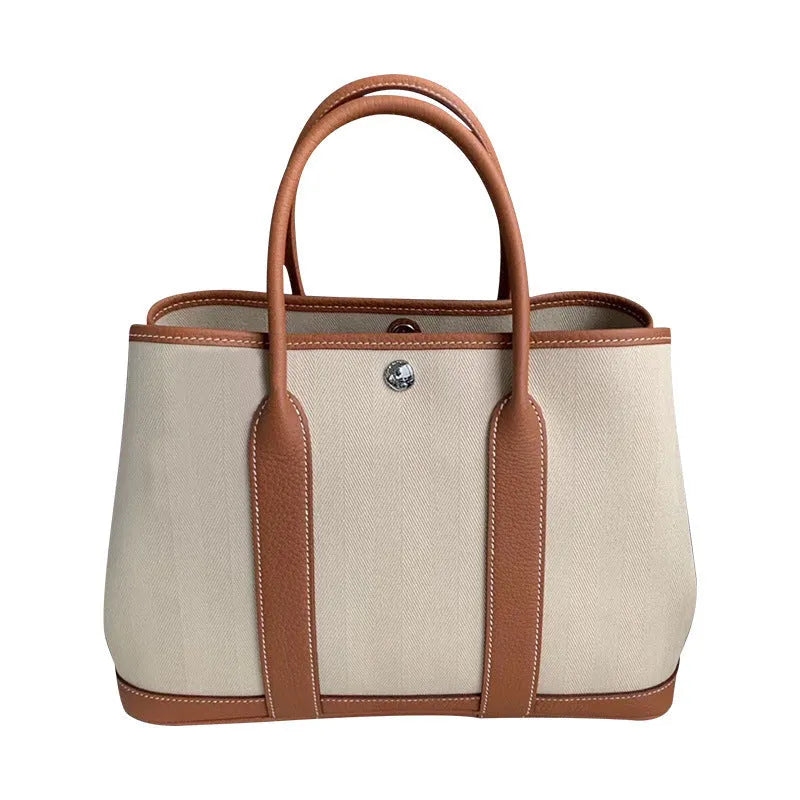 Women's canvas bucket tote bag with leather details in black, brown, gray, or red colours