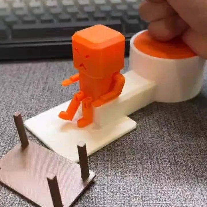 Orange plastic vent-shaped decompression toy for table turning, measuring 16cm long.